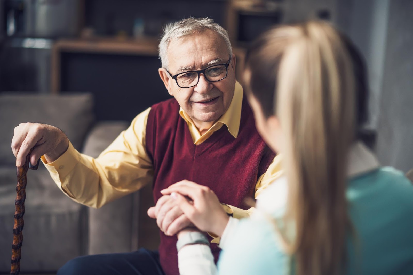 A man speaking with a care professional