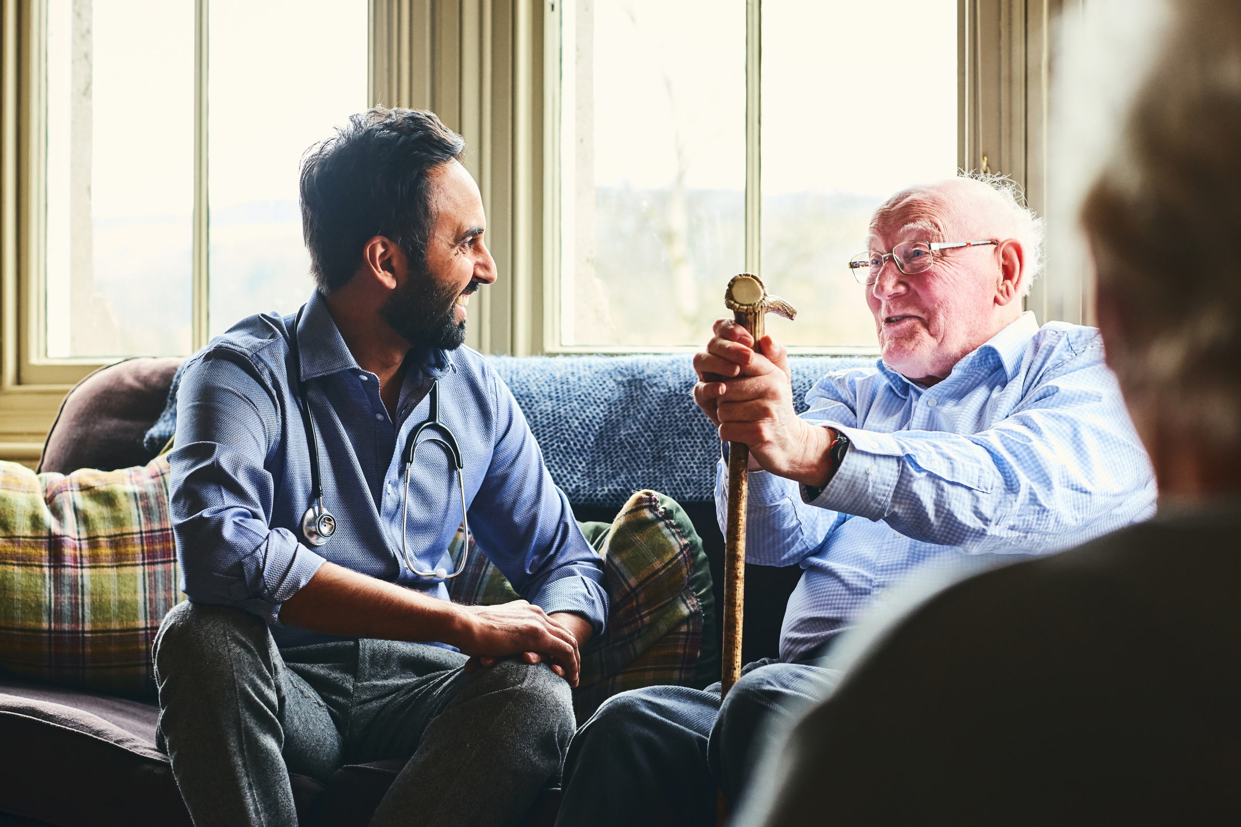A live-in carer spending time with an older man